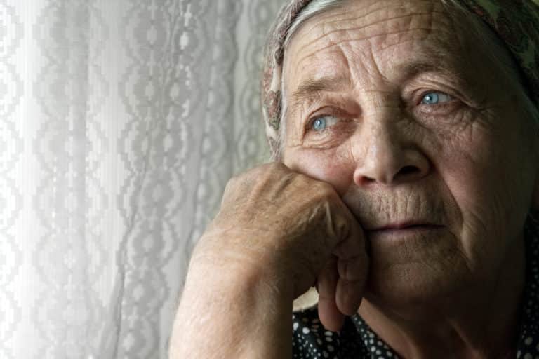 Sad lonely pensive old senior woman
