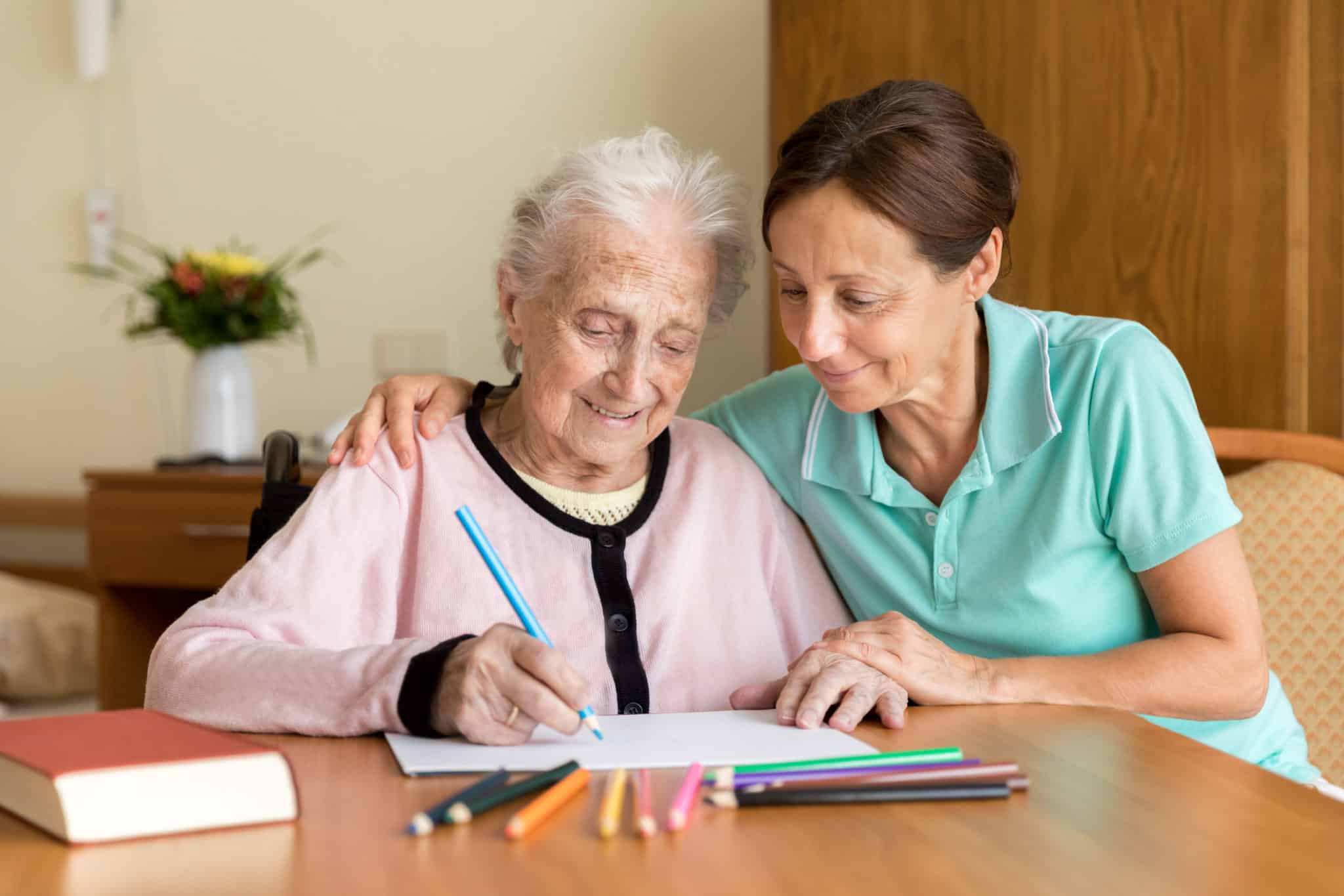 Dementia and Occupational Therapy - Home caregiver and senior adult woman