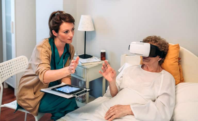 Older patient using virtual reality glasses