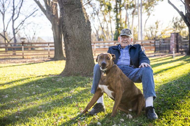 Portrait of a Senior Farmer with his Dog