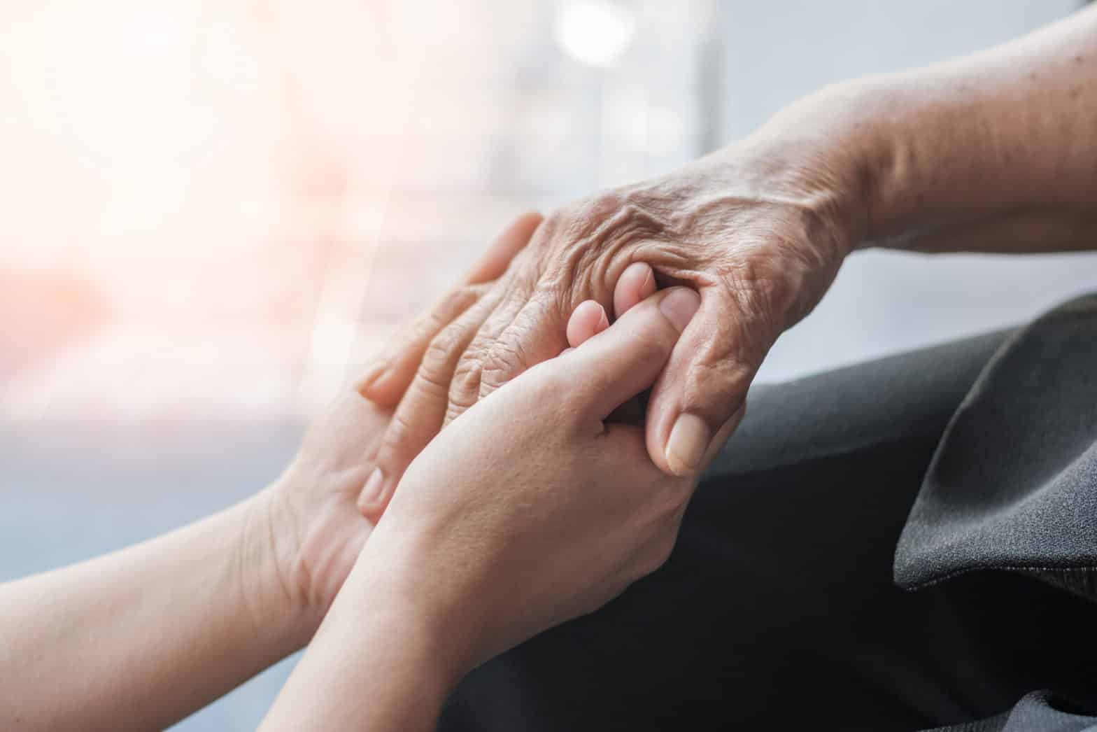 Parkinson disease patient, Alzheimer elderly senior, Arthritis person hand in support of nursing family caregiver care for disability awareness day, National care givers month, ageing society concept