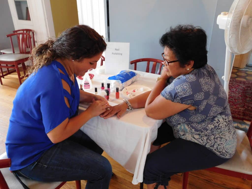 A gentle human touch during a manicure soothes hands and spirit.