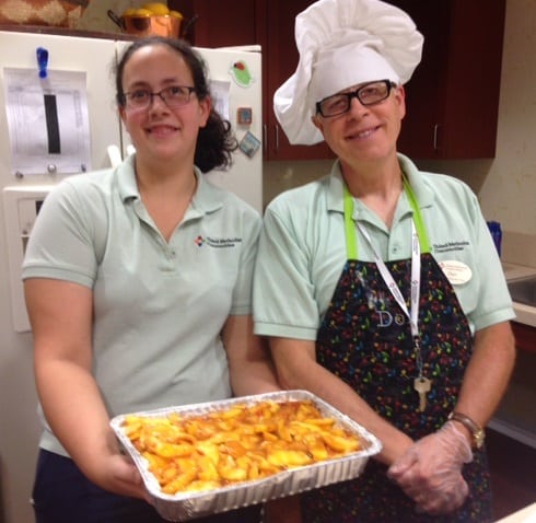 UMC at Pitman Employees Melissa and Don Jenkins show off the peach dessert they and residents of the Memory Support Residence made for the 8th Annual Just Peachy Festival.
