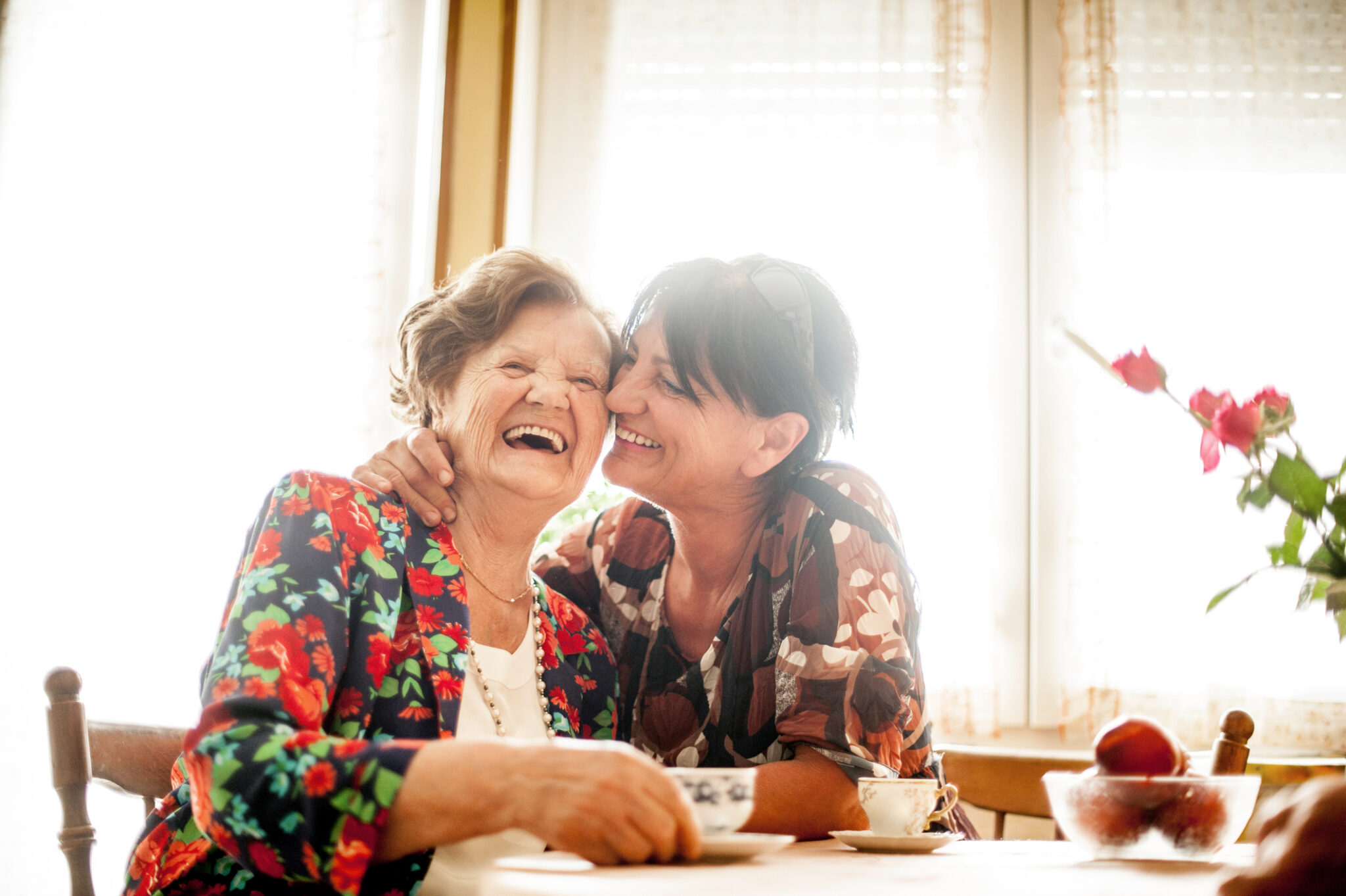 Senior Woman Relaxing with her Daughter at Home